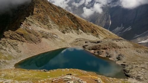 Small water body surrounded by mountains