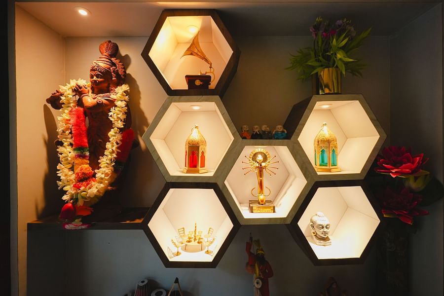 An image of a hexagonal shelf where various decorative elements are placed along with an idol at Rangamati Garden Resort