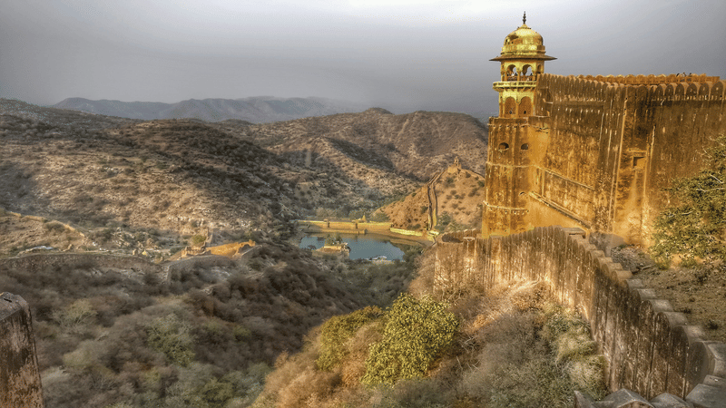 Fort watchtower overlooking the Aravalli valley at golden hour