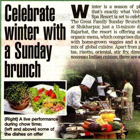 A newspaper clipping featuring sunday brunch at Vedic Village Spa Resort.