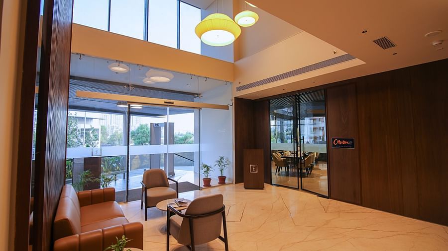 Overview of the Lobby area with comfortable seating at Essentia Premiere, Pune.