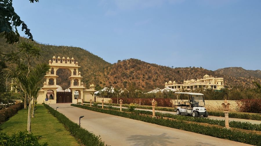 Image of a pathway with mountains in the background at Rajasthali Resort & Spa Jaipur.