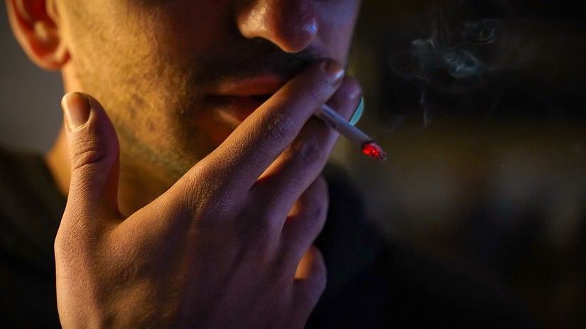 man smoking in public