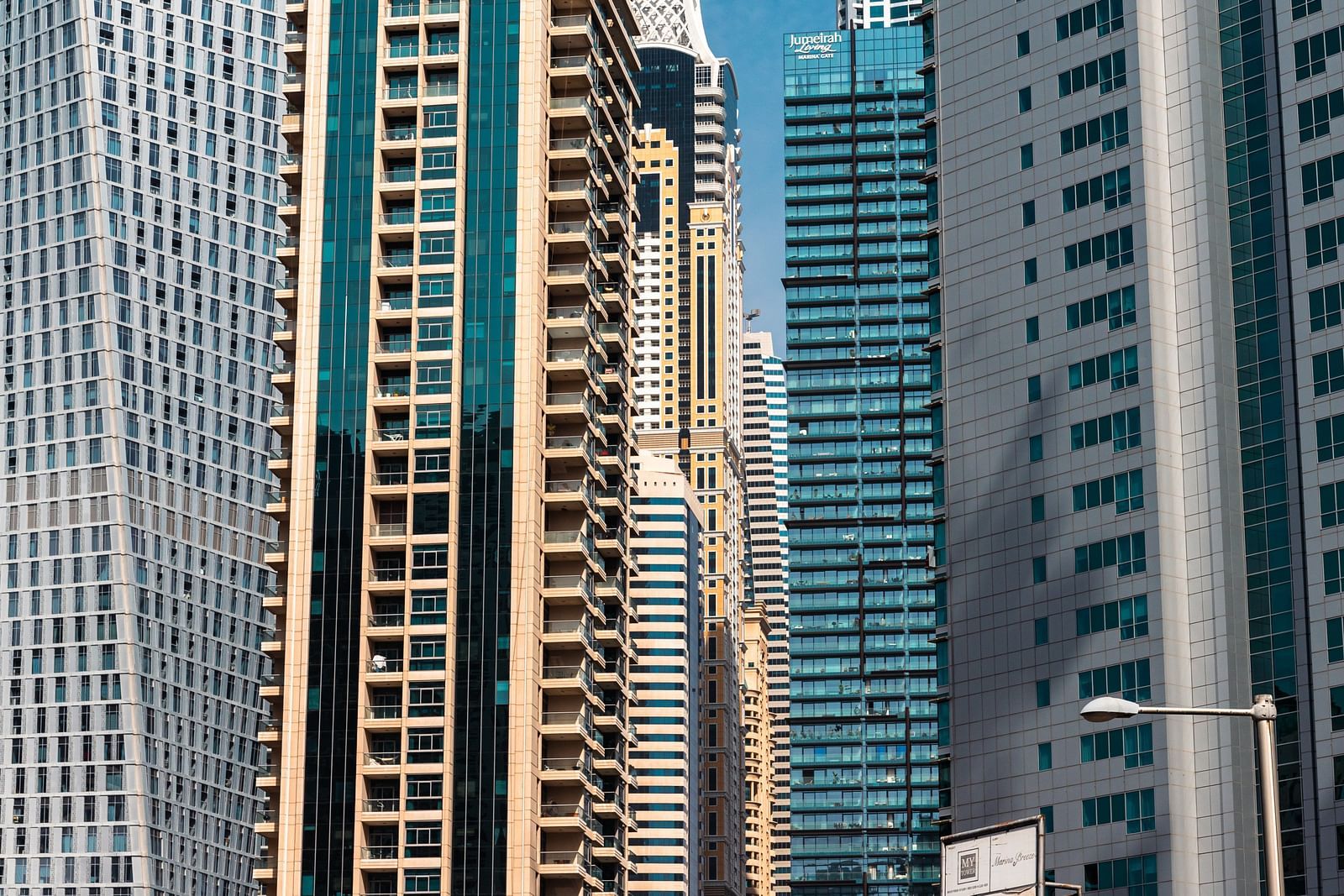An overview of many skyscrapers lined up back to back in a city.