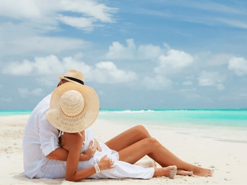 An image of couple relaxing on a pristine beach - S Hotel Montego Bay, Jamaica