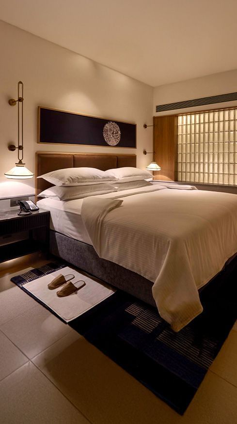 Corner view of our luxury rooms in Dukes Retreat, Khandala, featuring a double bed with modern interiors.