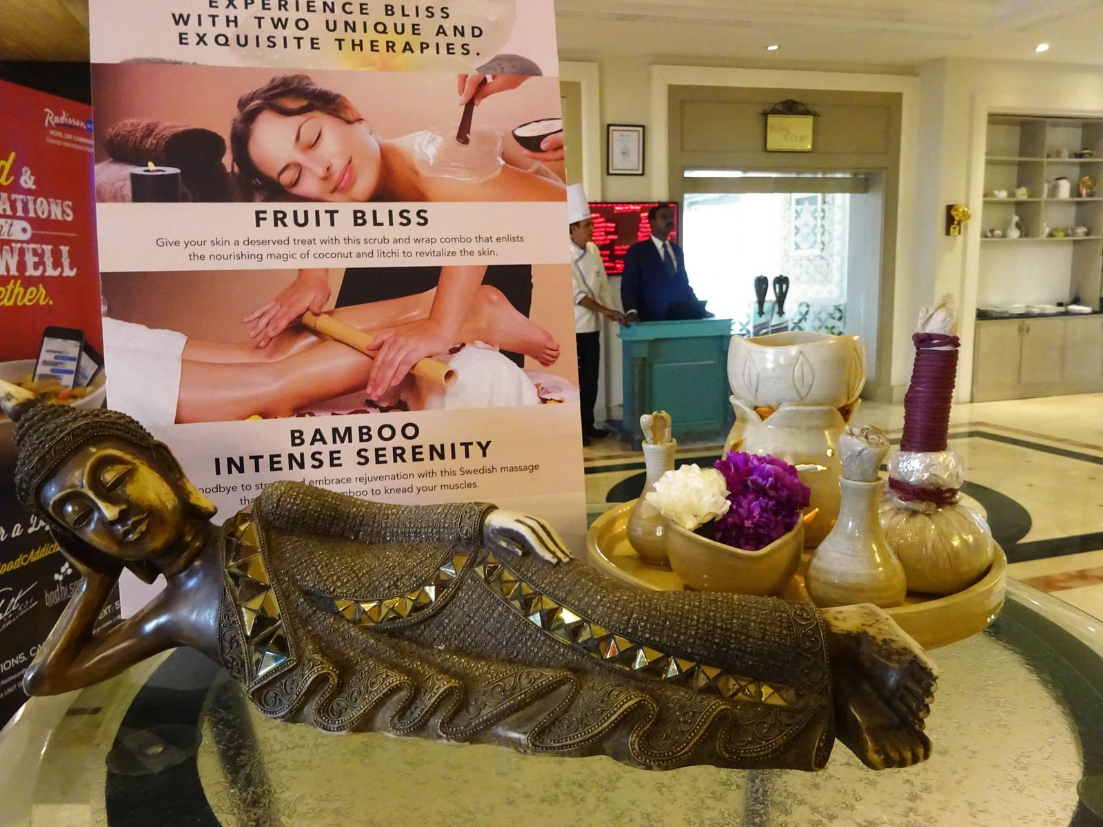 Spa relaxation setup with banners promoting wellness and massage services.