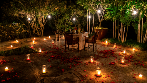Romantic candlelight dining experience set amidst the forest at The Serai Bandipur.