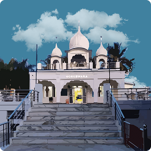 A white marble building with multiple domes, featuring a wide staircase leading to the entrance.