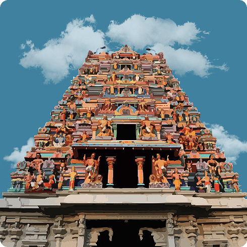 A vibrant, colourful gopuram of a temple against a blue sky, showcasing detailed sculptures.