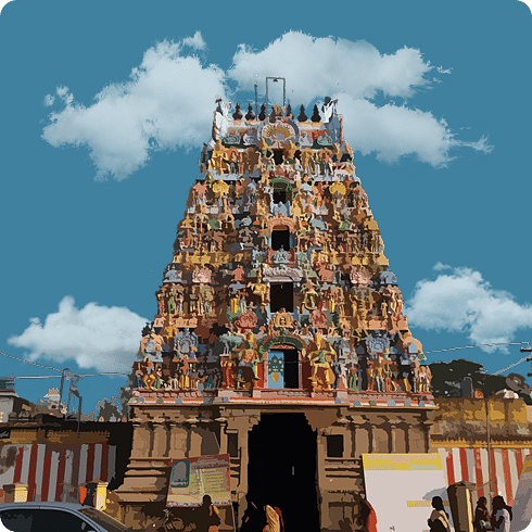A multi-tiered gopuram richly detailed with mythological figures, welcoming devotees with divine grandeur.