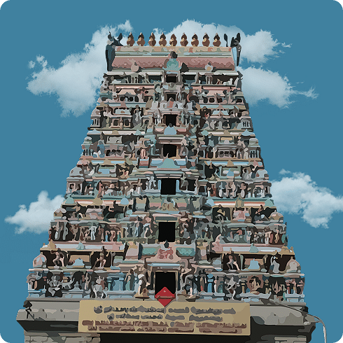 A vibrant gopuram adorned with multicoloured deities, marking the entrance to a busy South Indian temple.