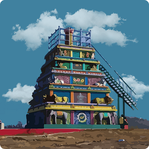 A modern, brightly coloured temple gopuram with a staircase under a blue, cloudy sky.