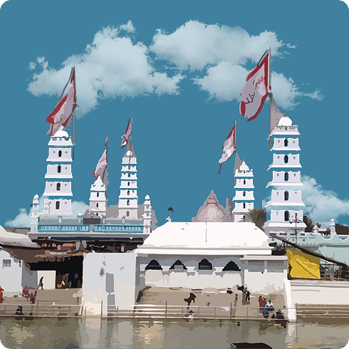 A riverside mosque with minarets and domes stands peacefully, draped in flags fluttering in the breeze.