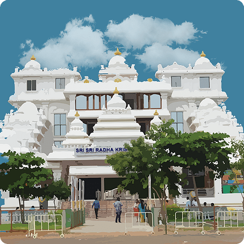 A grand white temple with sculpted towers and greenery at the entrance under a bright blue sky.