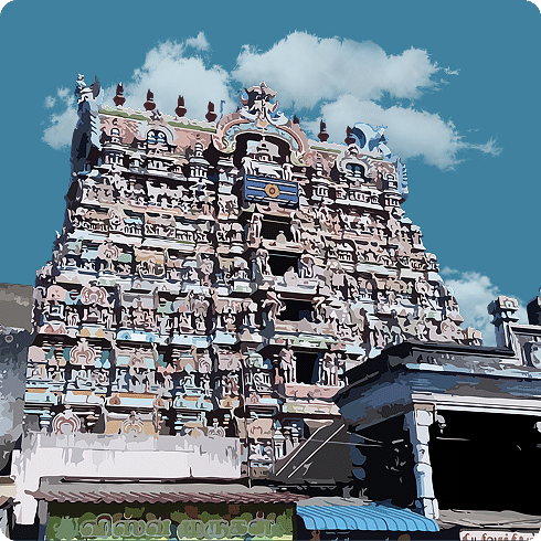 A colourful, detailed temple gopuram with numerous figures under a blue, cloudy sky.