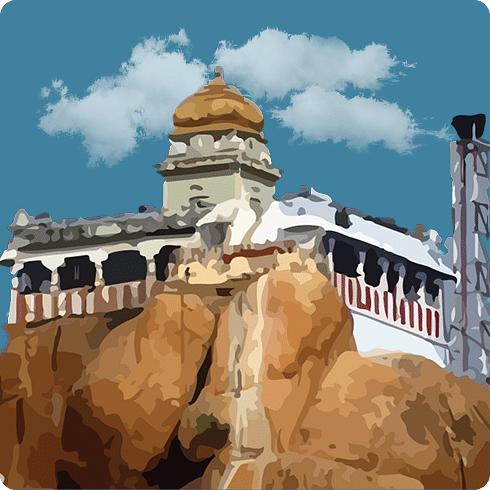 A temple built atop a rocky hill with a dome-shaped sanctum blends beautifully into its natural surroundings.