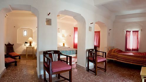 The spacious interiors of Nirmal Mahal - Pool View feature several archways for easy access to all rooms