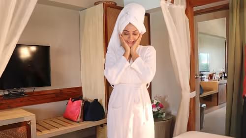 Woman in a bathrobe delighted at Swosti Chilika
