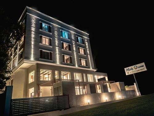 facade image of Misty Ocean, Pondicherry at night 