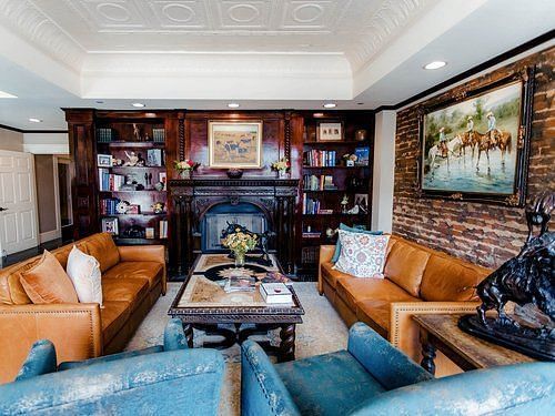 A warm and inviting lounge area with soft seating and tasteful decor, offering a comfortable place to relax - The Grand Hotel & Ballroom, McKinney