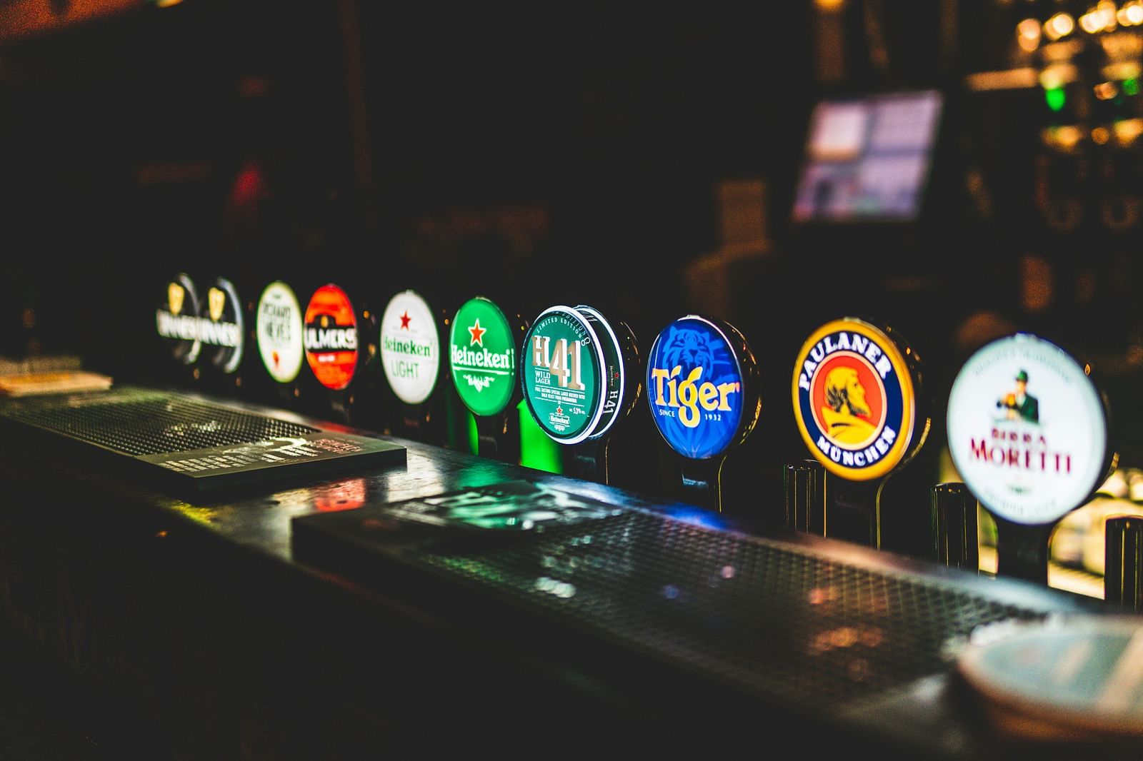 an image of alcohol brands displayed  in a bar.