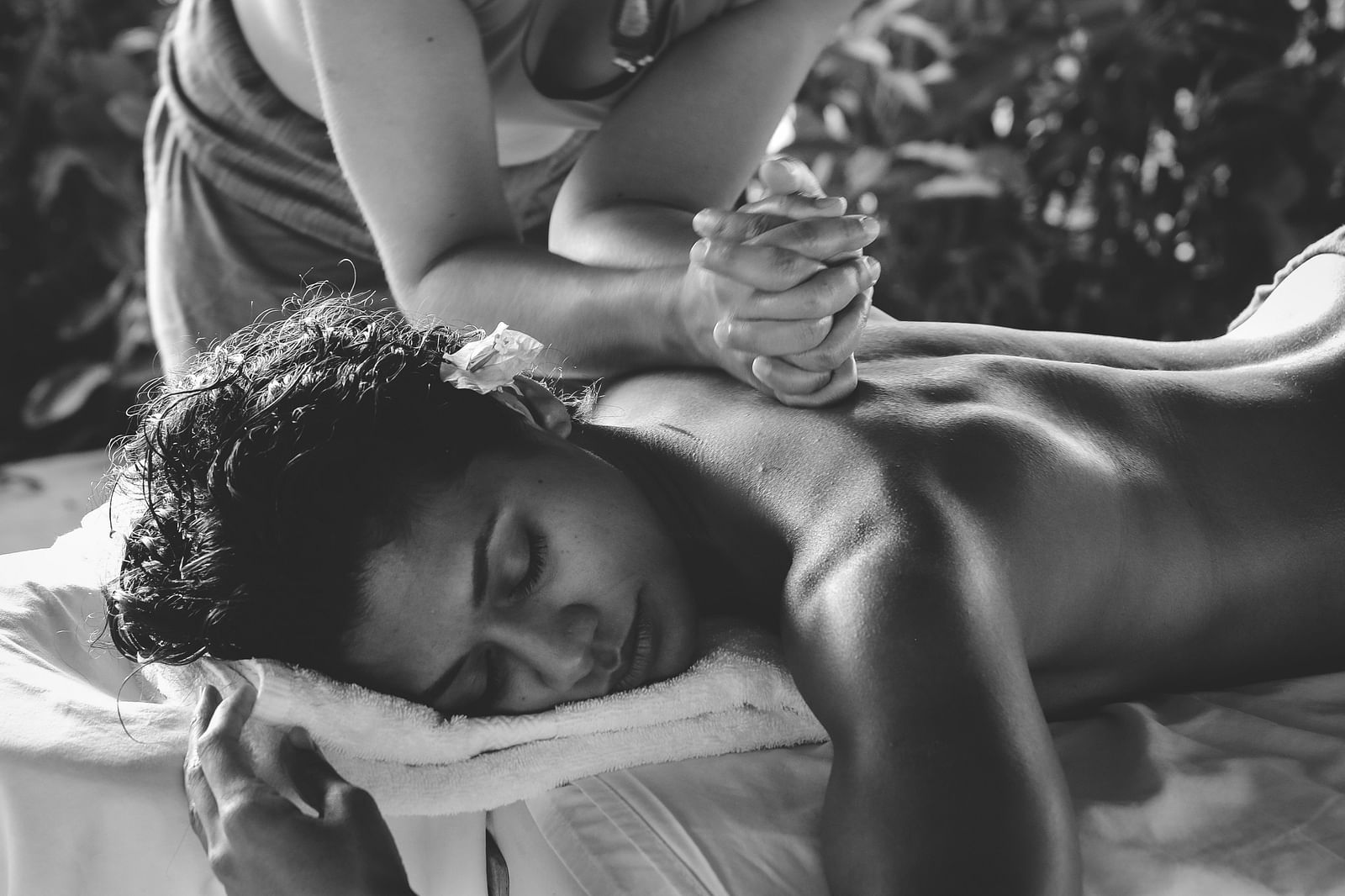 an image of a woman getting a back massage - Kerala Ayurveda