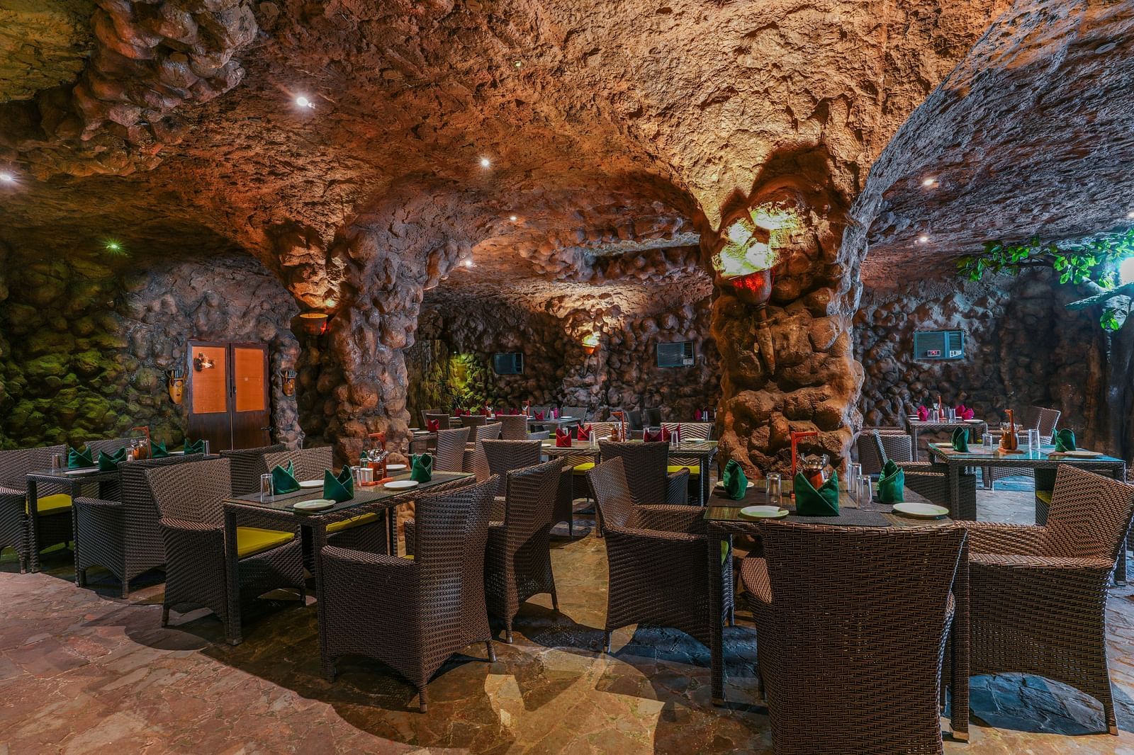 Kholong restaurant with a rock-themed décor, warm lighting, all tables, seating, and culinary arrangements arranged aesthetically6