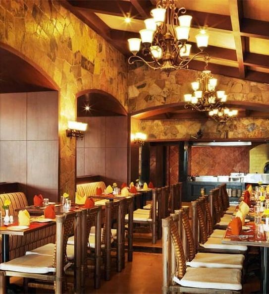A side angle of dining area with light on during the night at Ocean Spray, Puducherry