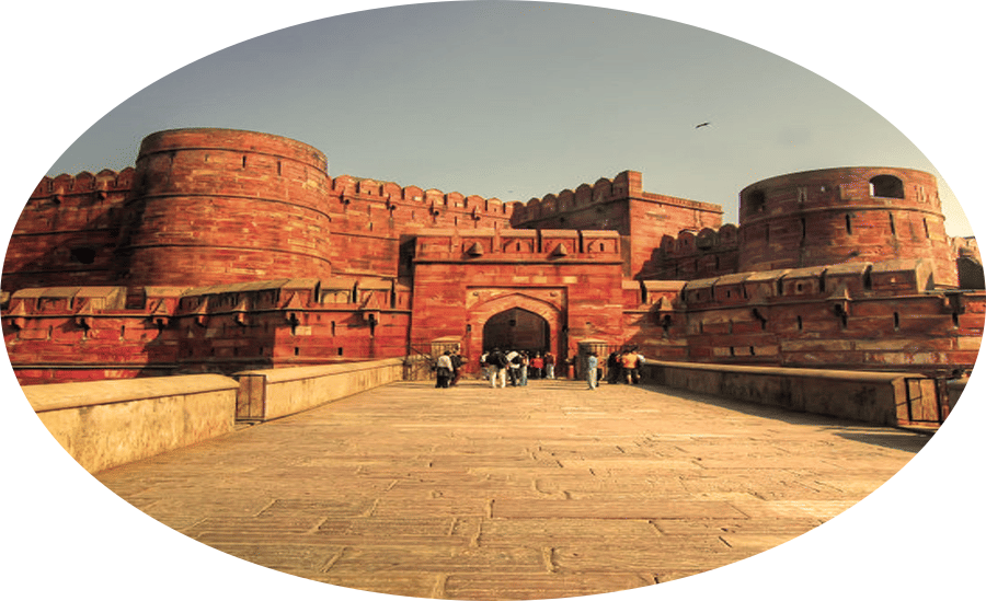 Red Fort in Agra featuring a long pathway leading to a big monumental structure.