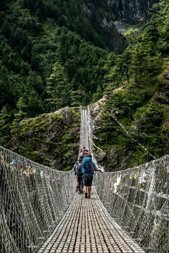 An image of people crossing the rope bridge that will lead them to another valley | Kavya Resort and Spa, Nagarkot