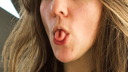a person's mouth with their tongue rolled into a tube shape at YO1 Longevity & Health Resorts