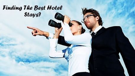 Two people in formal clothing looking through binoculars under a bright sky, with the text 'Finding The Best Hotel Stays?' in the image.