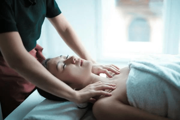 A person receiving a relaxing shoulder massage in a serene spa setting, embodying tranquility and self-care.