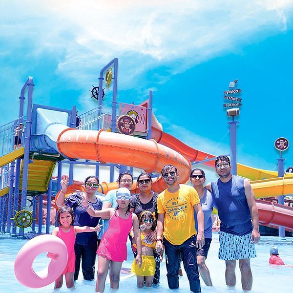 A group of people in front of a water park - Diamond Parks, Pune 