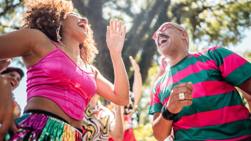 A view of People enjoying one of the New Year Events in Goa with a tree in the background.