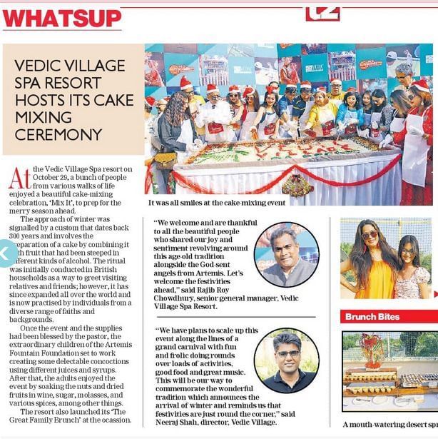 A newspaper clipping featuring a story in t2 on cake mixing ceremony at Vedic Village Spa Resort.