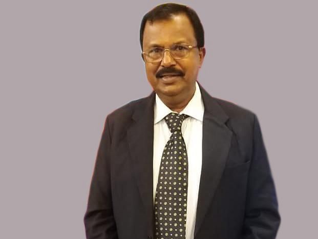 Finance Director Shivashankar in a gray background at UDS Group of Hotels