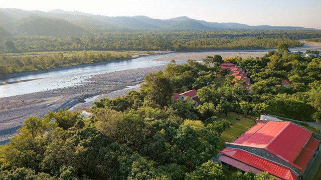 Scenic landscape with river flowing beside the tranquil resort.
