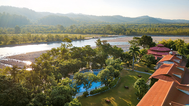 Riverside resort with scenic mountain views and natural surroundings.