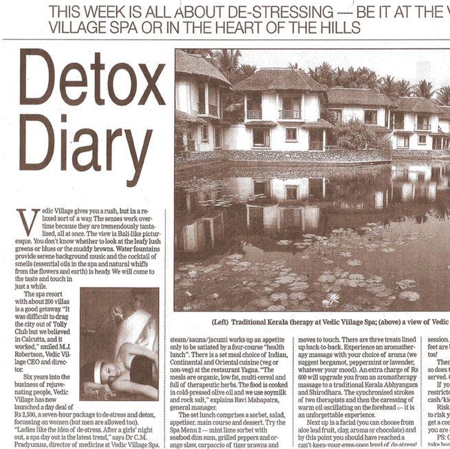 A newspaper article titled Detox Diary featuring a photo of Vedic Village Spa Resort buildings reflected in a water body, with accompanying text.