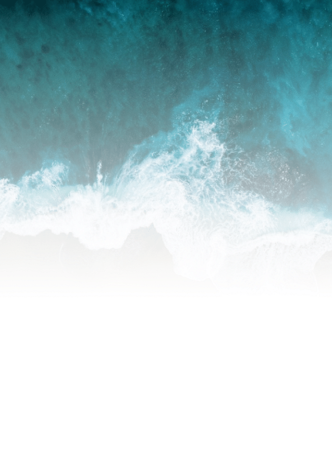 sea water near the beach overlapping on the sand with white foam near the sands