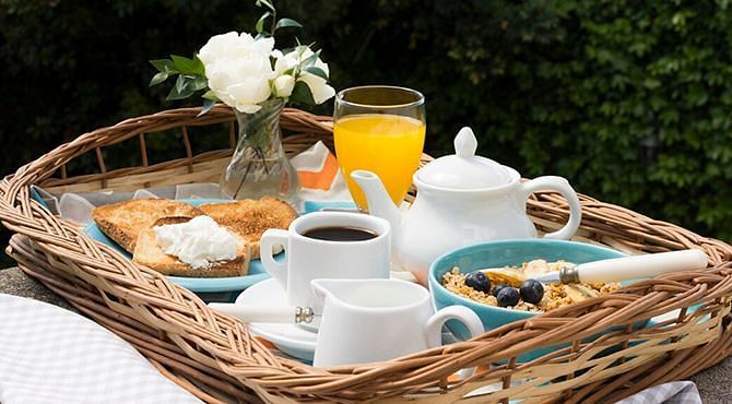 A breakfast platter served on a basket at Nirvana Luxury Hotel, Ludhiana.