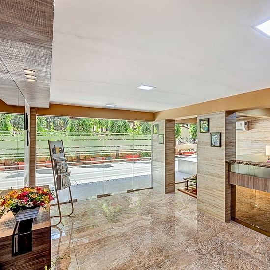 A wide shot of the entrance and reception of Maxxvalue Apartment, Marol