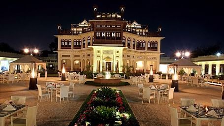 A facade image of Khaas Bagh in a night time setting