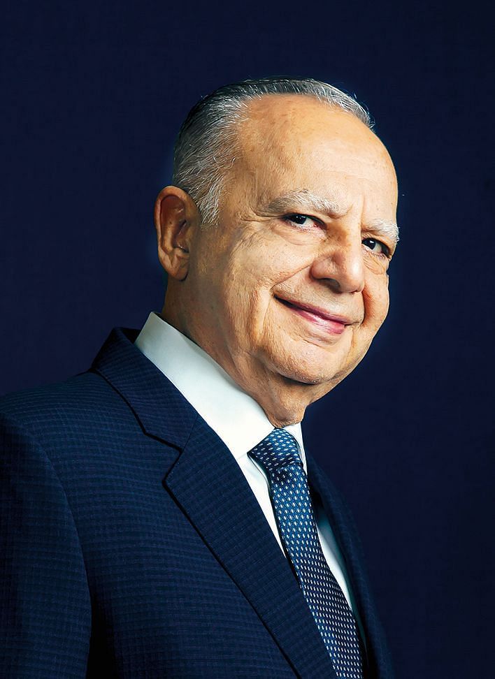 an old person posing for a picture wearing a suit CMD photo for press