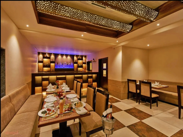 Restaurant with luxurious interior for comfortable dining at Ramanashree Richmond.