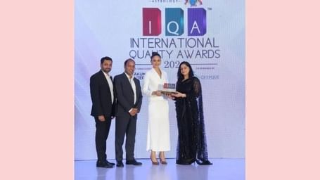 Group photo of four individuals standing on stage at the International Fame Awards 2024 event at Ilara Hotels & Spa.