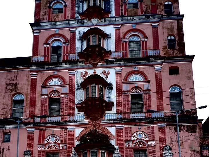 Pink-colored historical building with intricate architectural designs