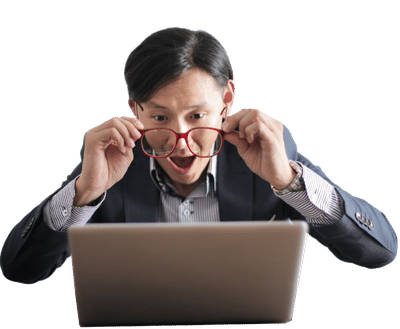 A man amazed at results on his laptop after using Simplotel's hotel reservation software.